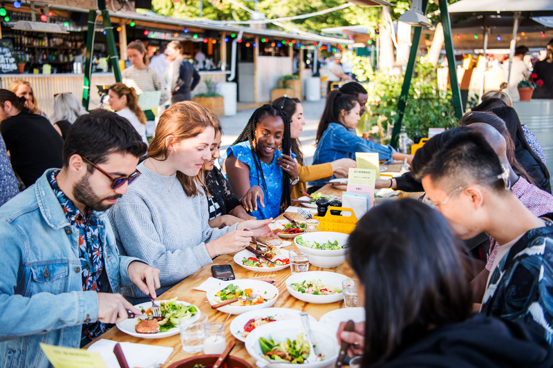 People enjoying food outdoors