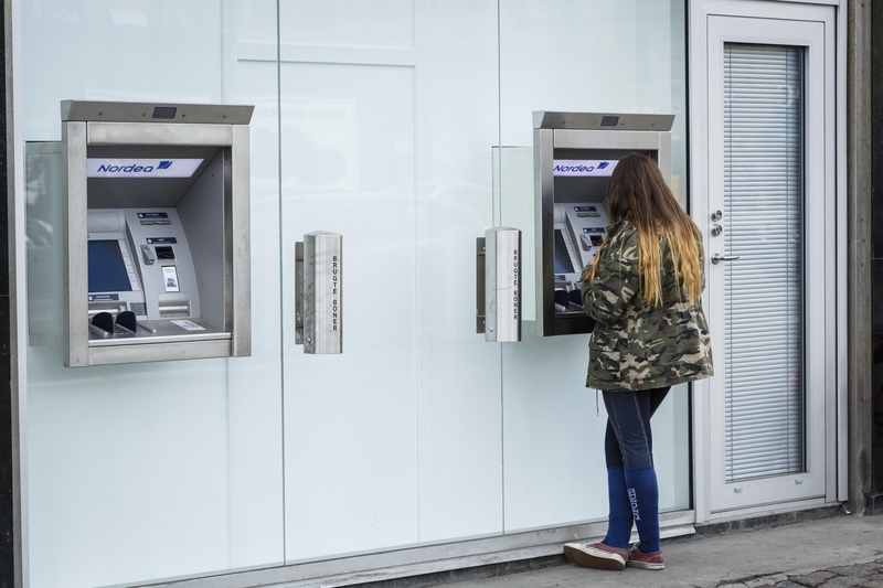 A woman at an ATM in Copenhagen, Denmark.