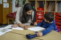 Teacher and pupil in classroom